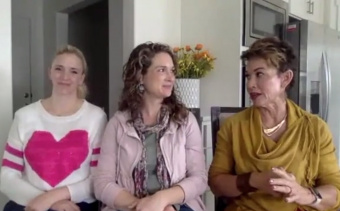 3 women sitting side by side talking to each other