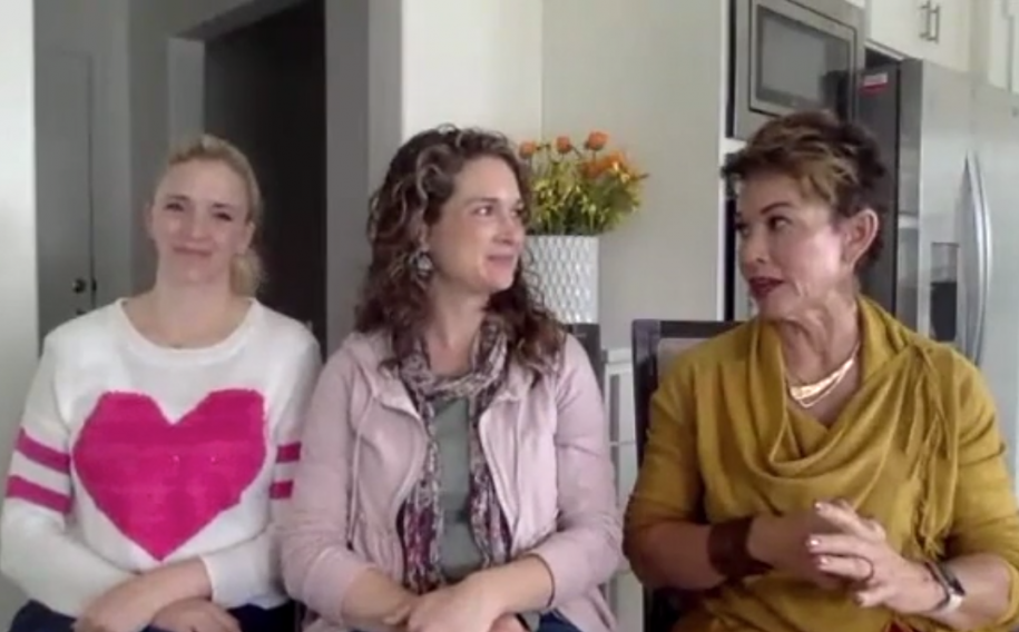 3 women sitting side by side talking to each other