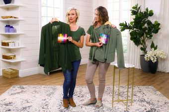 Sarah and Anne wearing and holding green tops in their own Types